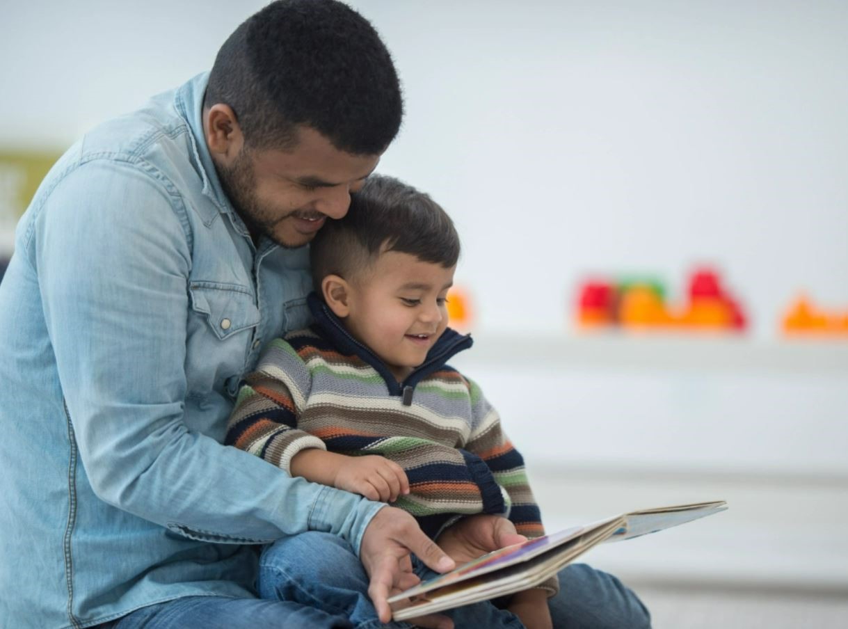 Image of father and child reading