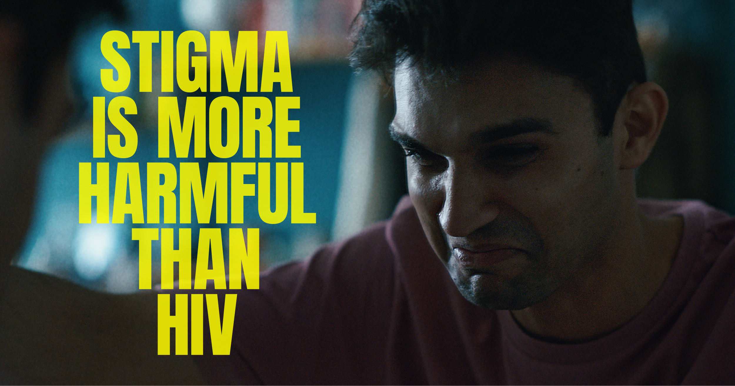 Image of a person in distress and text reading stigma is more harmful than HIV